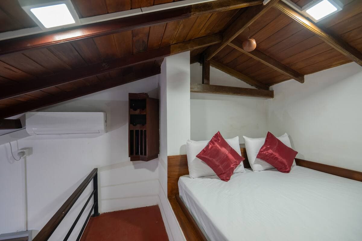 Luxury Attic Room loft suite with stairs, kitchenette and bedroom — photo 1