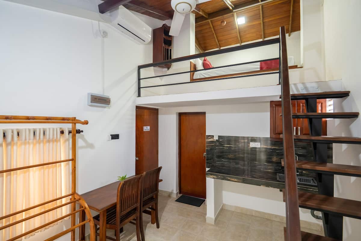 Luxury Attic Room loft suite with stairs, kitchenette and bedroom — photo 4