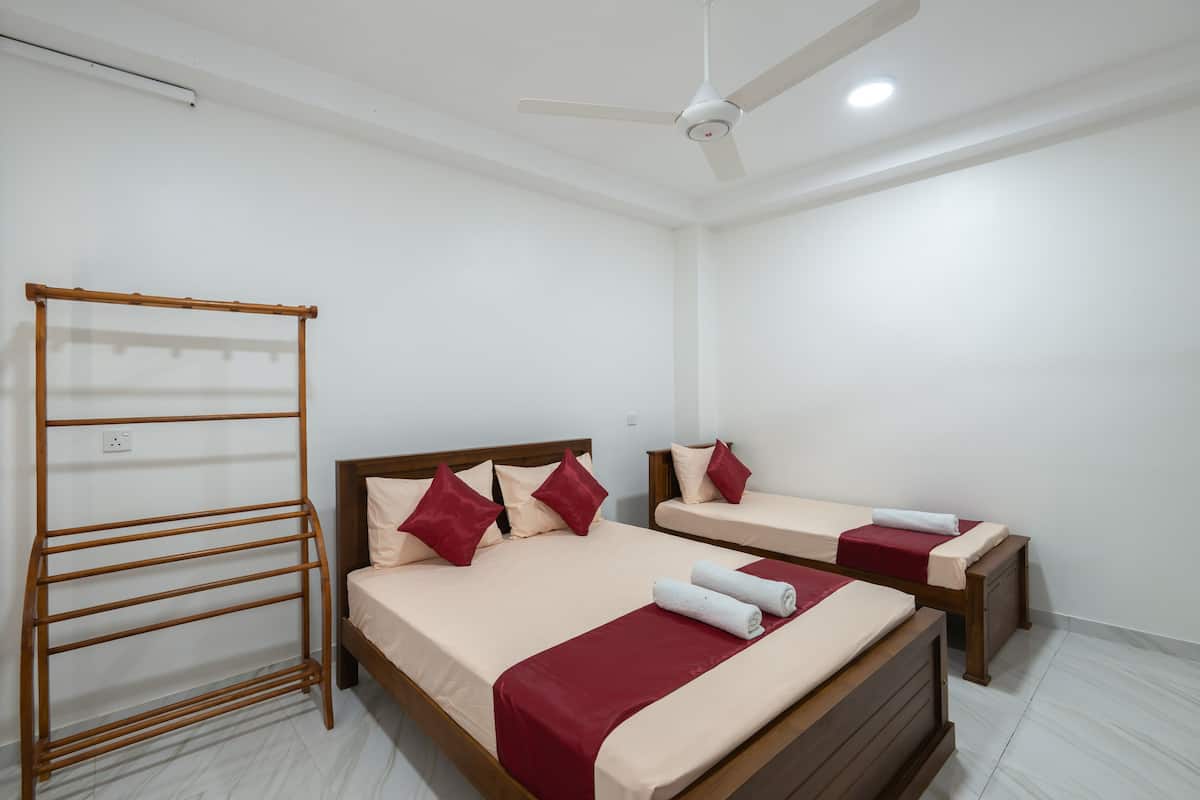 Cool Triple A/C Suite multi-bed room at Reliance Inn — photo 1