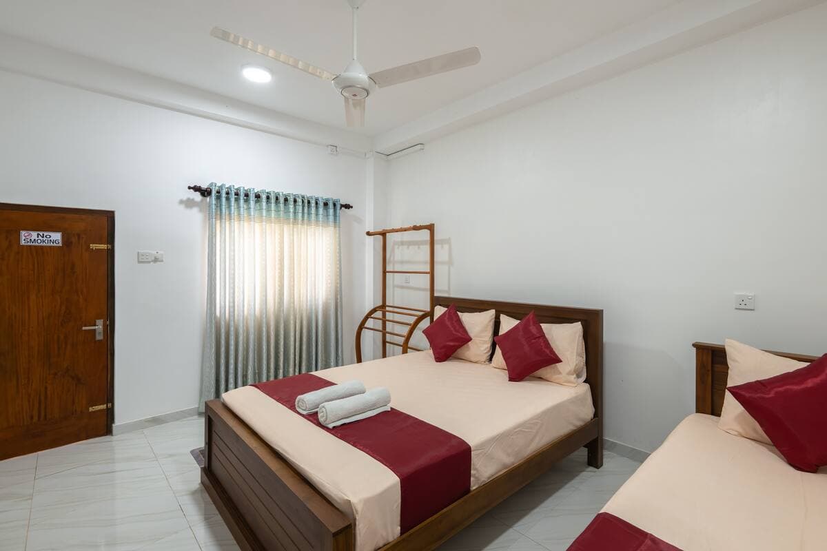 Cool Triple A/C Suite multi-bed room at Reliance Inn — photo 2